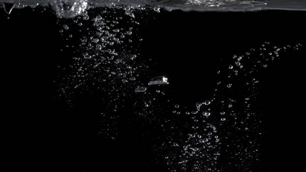 istock Bubbles underwater splashing and floating up and black color background which represent carbonate drink such as soda or cola and sparkling water from nature that can use for refreshing or freshing concept 1208266021