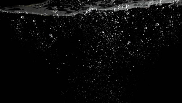 istock Bubbles underwater splashing and floating up and black color background which represent carbonate drink such as soda or cola and sparkling water from nature that can use for refreshing or freshing concept 1208266033