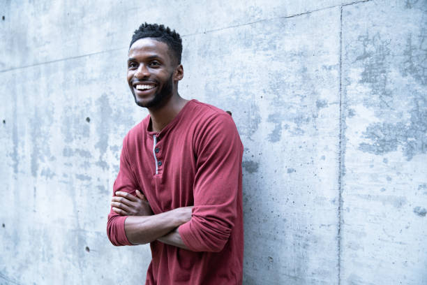 istock Black Male Against a Concrete Wall 1208269870