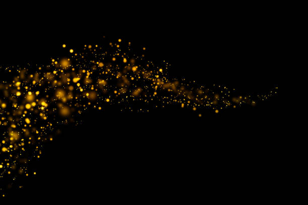 istock Golden light bokeh and abstract glittering on dark background. Sparkling dust particles. 1208270636