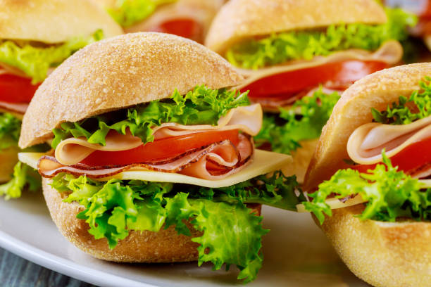 istock Delicious sandwiches made from ciabatta roll with ham. Close up. 1208272086