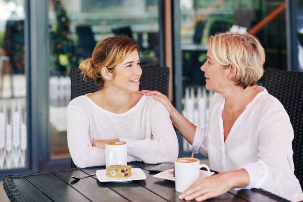 istock Mother and daughter sharing secrets 1208272173