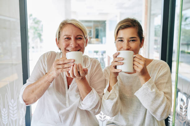 istock Happy women drinking coffee 1208272197
