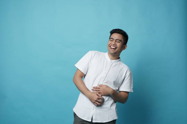istock Laughing LOL Southeast Asian Young Man - Copy Space 1208274300