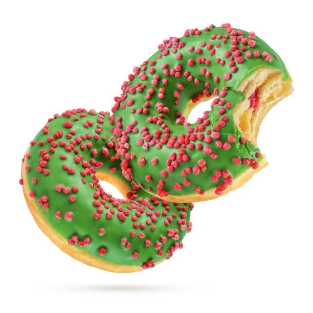 istock Christmas glazed donuts isolated on white background. 1208277050