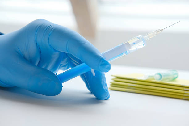 istock Doctor´s hand holds a syringe for vaccination. 1208286057