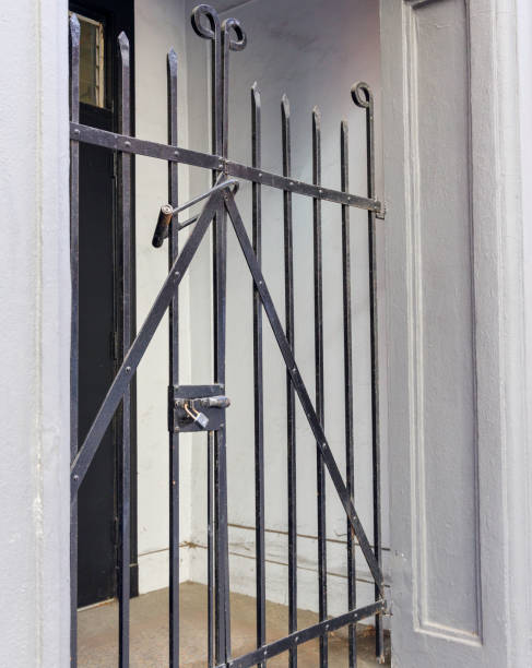 istock Closeup of outside door locked gate 1208297663