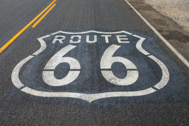 route 66 sign on empty road in california, united states - route 66 road sign california imagens e fotografias de stock