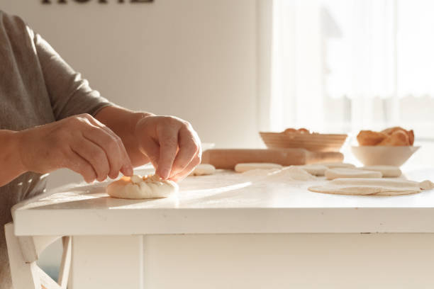istock woman preparing fried pastry from dough 1208298968