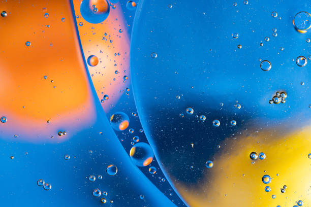 istock Large beautiful Oxygen bubbles underwater on a blue background macro. 1208302238