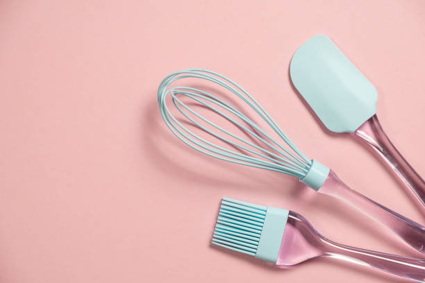 istock Blue silicone backing utensils on pink background, top view with cpy space 1208302258