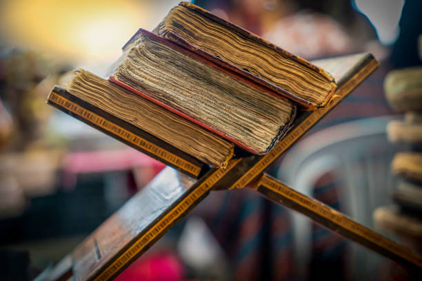 Old books in a flea market for sale, selective focus.