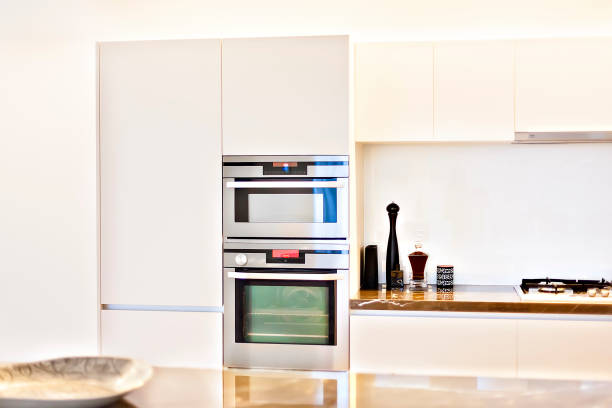 istock kitchen oven close up with perfumes and pantry cupboards 1208303040