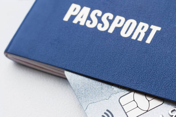 istock Blue passport with platinum credit card. Closeup, selective focus 1208303509