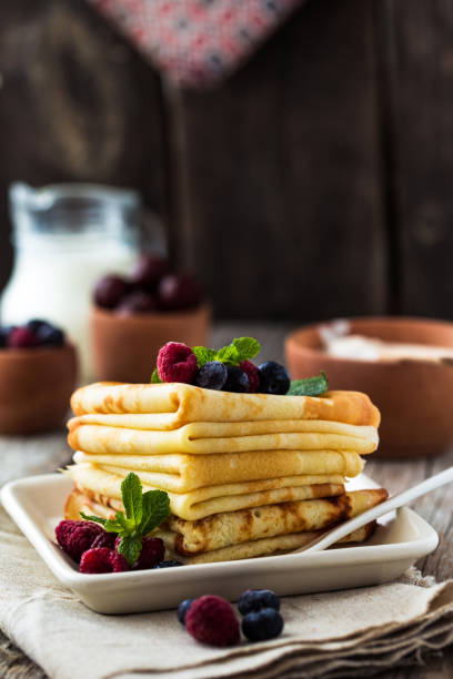 istock Stack of thin russian pancakes or crepes made for shrove Tuesday or Maslenitza, spring celebration 1208308295