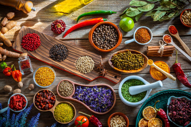 istock Spices herbs condiments seasoning on rustic yellow wood 1208308343