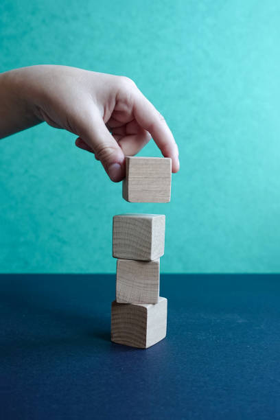 istock Hand arranging wood block stacking. Business concept for growth success process 1208308695
