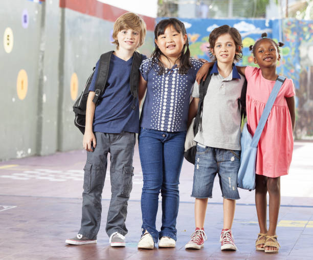 istock Multiethnic group of schoolchildren playing at school 1208309351