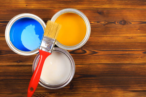 istock House renovation, paint can on the old wooden background with copy space 1208309636