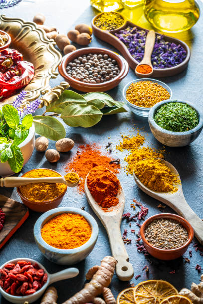 istock Spices herbs condiments seasoning on grunge gray background 1208309655