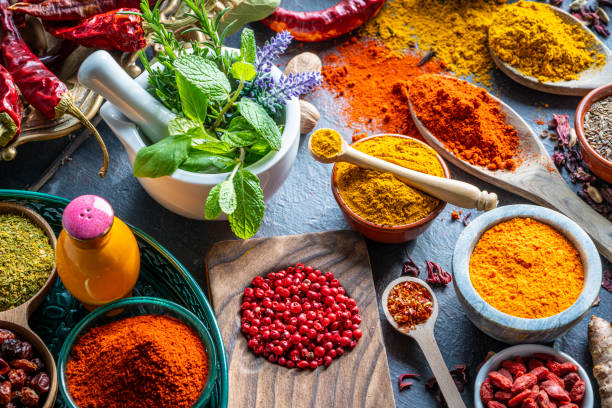 istock Spices herbs condiments seasoning on grunge gray background 1208310490
