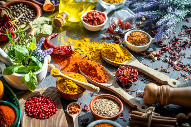 istock Spices herbs condiments seasoning on grunge gray background 1208310541