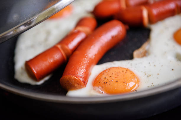 istock Bull's eye eggs fried in a pan with sausage 1208311128