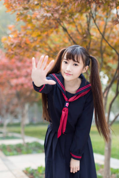 istock cute chinese female students 1208311303