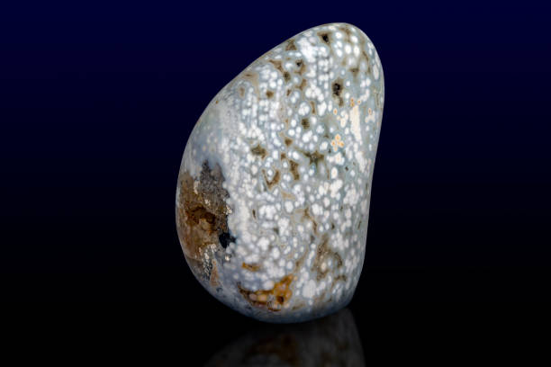 istock Minerals, crystals and stones: Jasper isolated on dark / white background 1208312008