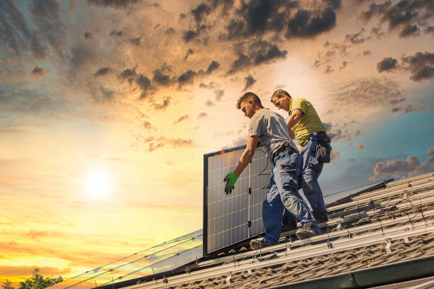 istock Low Angle View Of Men Working On Roof Against Sky 1208312806