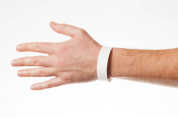 istock Hand with white wristband mockup. Empty ticket wrist band design 1208314686