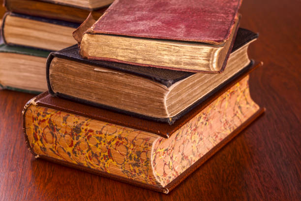 istock Old Books on Dark Wood Background 1208315350