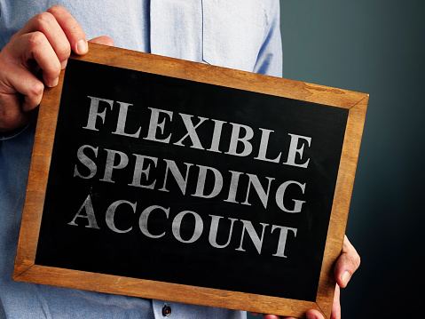 Flexible Spending Account FSA sign on the blackboard.