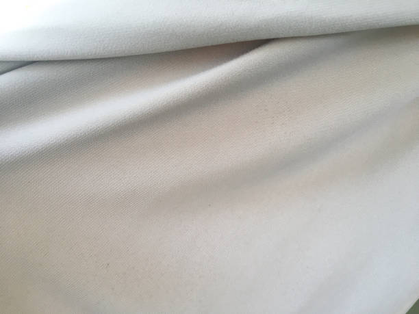 istock White silk or satin luxury cloth texture background for design. copy space for text, top view. 1208319054