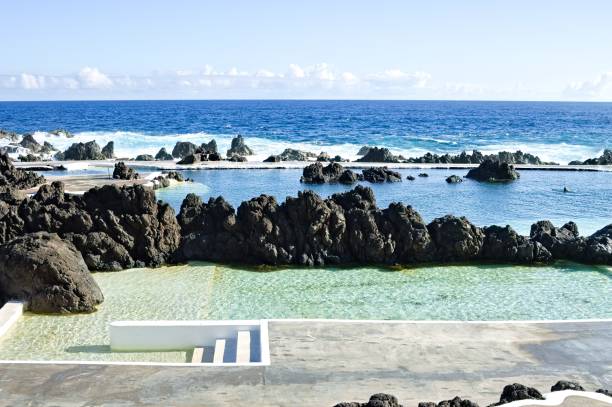 istock Natural pools with black vlcanic rock in the Atlantic Ocean (Porto Moniz, Madeira, Portugal, Europe) 1208319388
