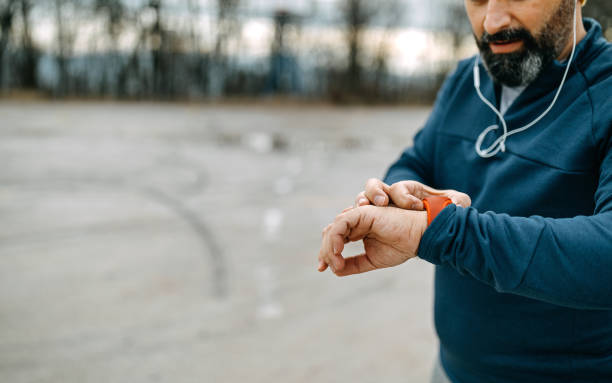 istock Mature men running and using smart watch outdoors 1208320462