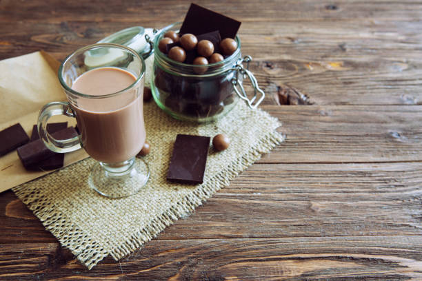 istock Delicious chocolate smoothie with marshmallows on dark table 1208323676
