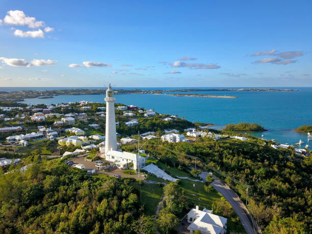 The drone aerial view of Bermuda island and the Gibbs hill lighthouse he Gibbs Hill Lighthouse is the taller of two lighthouses on Bermuda, and one of the first lighthouses in the world to be made of cast-iron. bermuda stock pictures, royalty-free photos & images