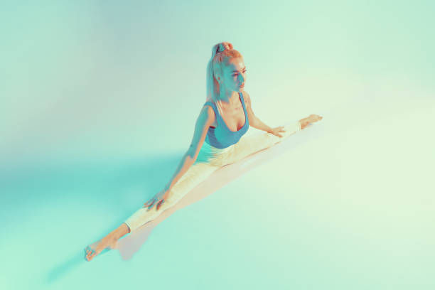 istock Athletic young woman doing yoga exercise 1208325421