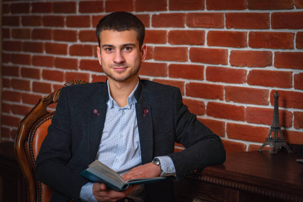 istock .Handsome young man dressed in comfortable stylish clothes for everyday work. 1208328395