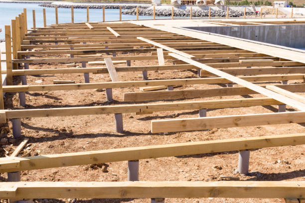 Timber foundation construction for a new house near the sea