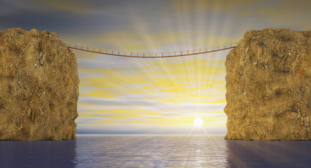 istock Suspension bridge on sea sunset 1208329569
