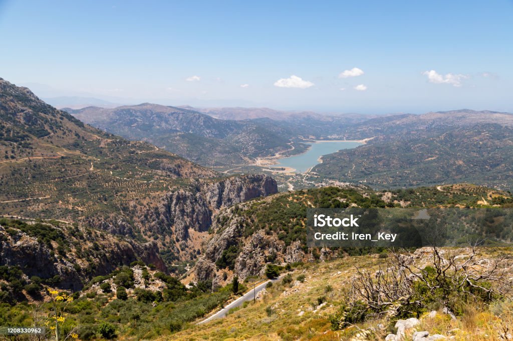 Road serpentine in the mountains. Lassithi Plateau located the Lasithi regional unit in eastern Crete, Greece. Mountain Stock Photo
