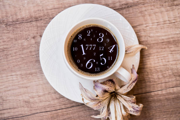 Morning coffee on the table and numbers, fortune telling and numerology Morning coffee on the table and numbers, fortune telling and numerology caffeine photos stock pictures, royalty-free photos & images