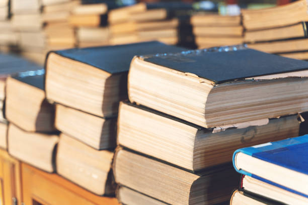 istock old books on wooden shelf. 1208331424