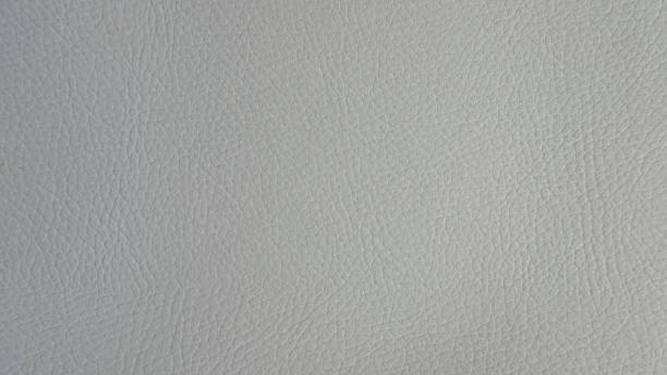 istock Light grey artificial or synthetic leather background with neat texture and copy space 1208332834