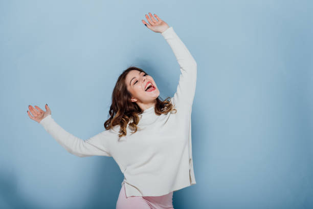 istock Cheerful woman having fun and dancing 1208333908
