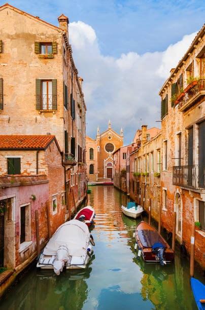 istock Venice canal view with ancient church 1208333988