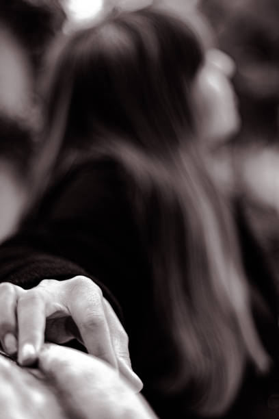 istock Blur woman and focused hand. 1208334627