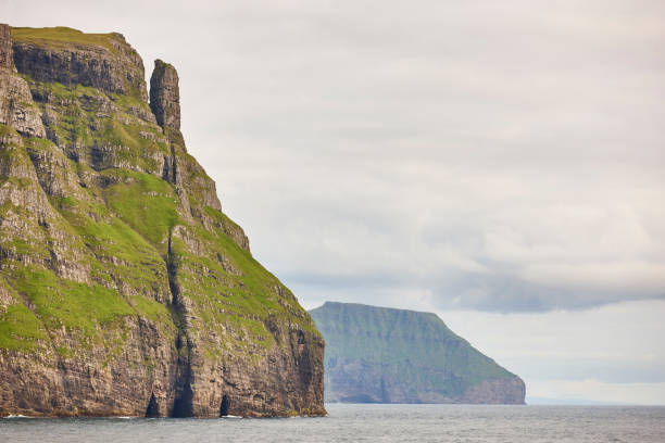 istock Faroe islands green landscape and atlantic ocean. Vagar 1208335842